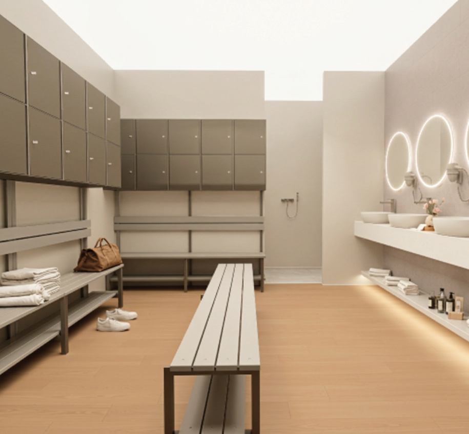 Vestuario de CharlyDance Hub con lockers, bancos y lavabos.